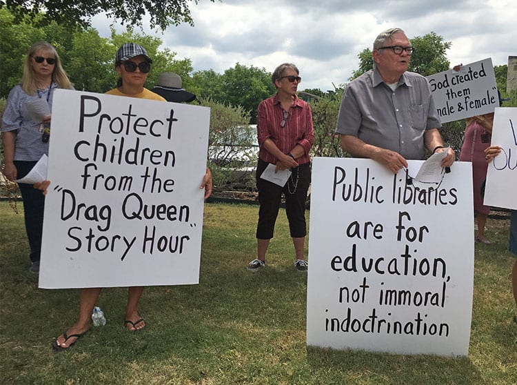 Creepy “Drag Queen” at Dallas public library reads book “What color is your underwear” to small children (see video!) as MassResistance holds strong protest outside.