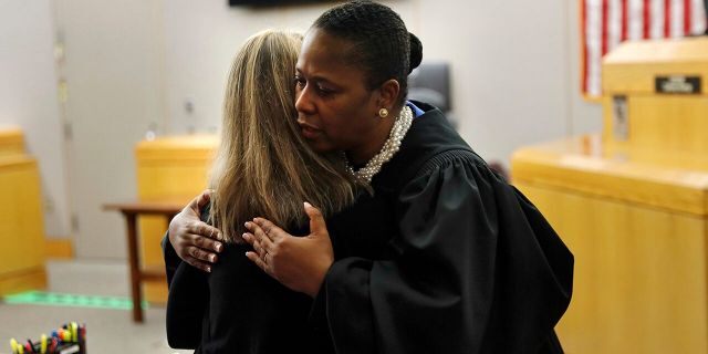 Judge hugs Amber Guyger, gives her a Bible after murder conviction, causing stir