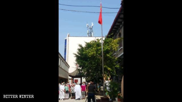 Must Raise National Flag and Sing Anthem to Reopen Church