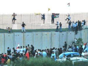 Lebanon militants rush Israel's border fence